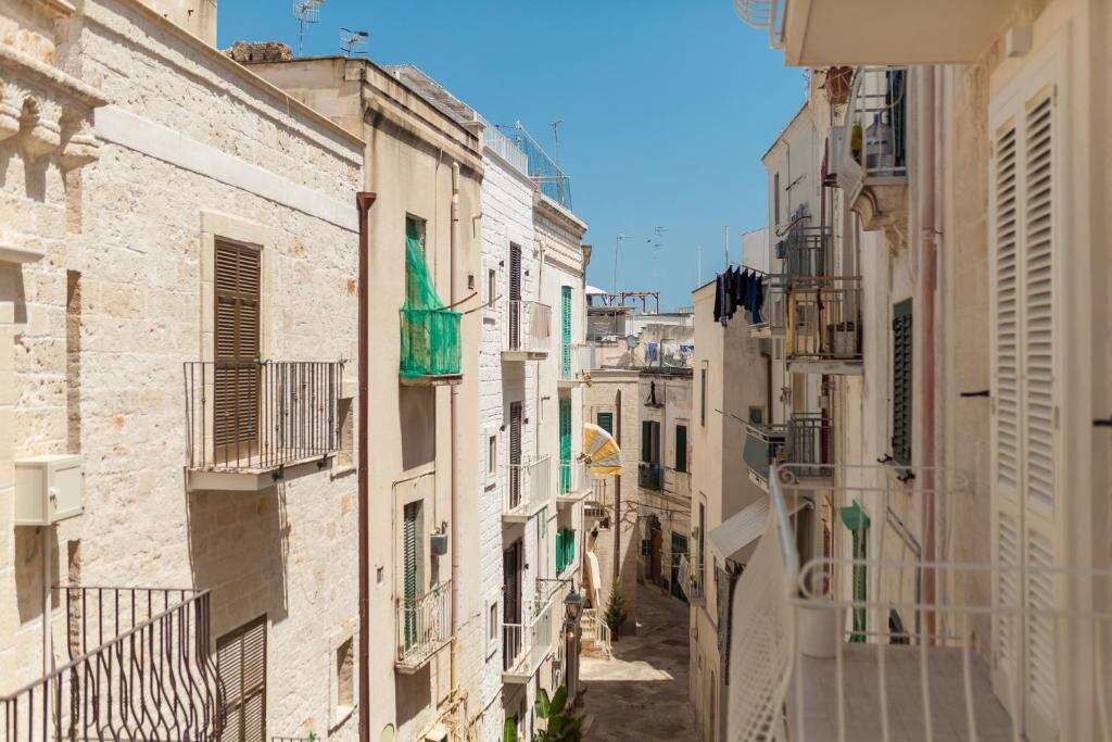 View along a narrow street of the historic centre of Monopoli